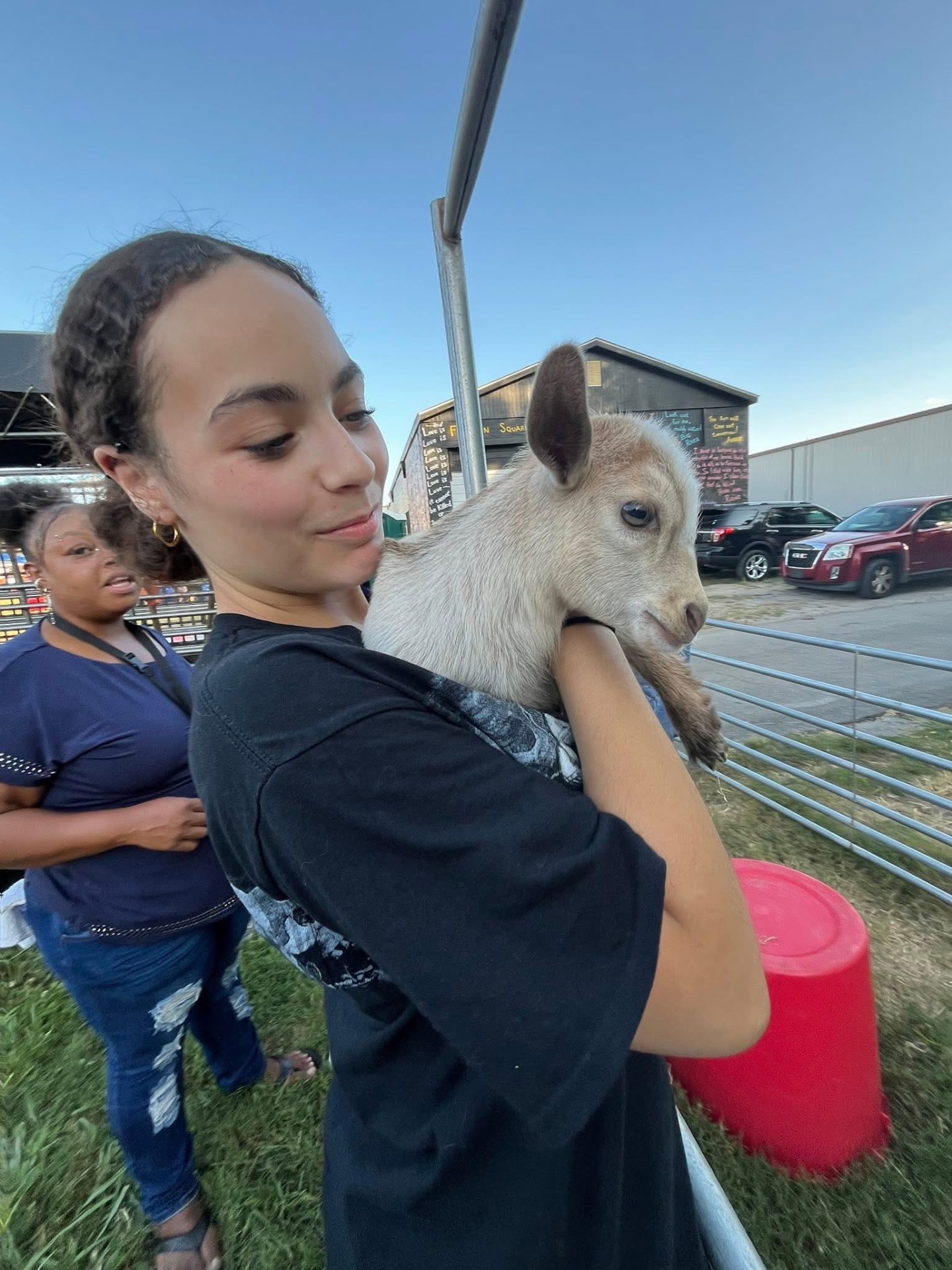 Brooklyn holding a baby goat